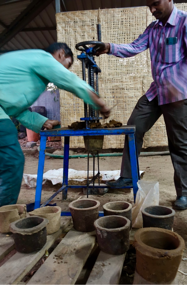  Making cow dung planting pots at the Eco Factory Foundation's waste management demonstration park.